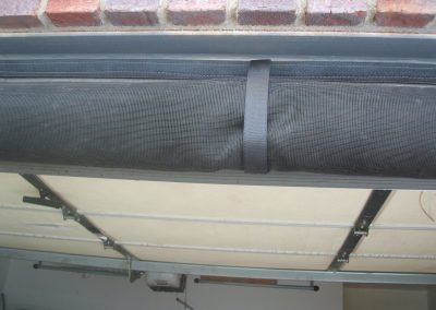 Garage door screen rolled up